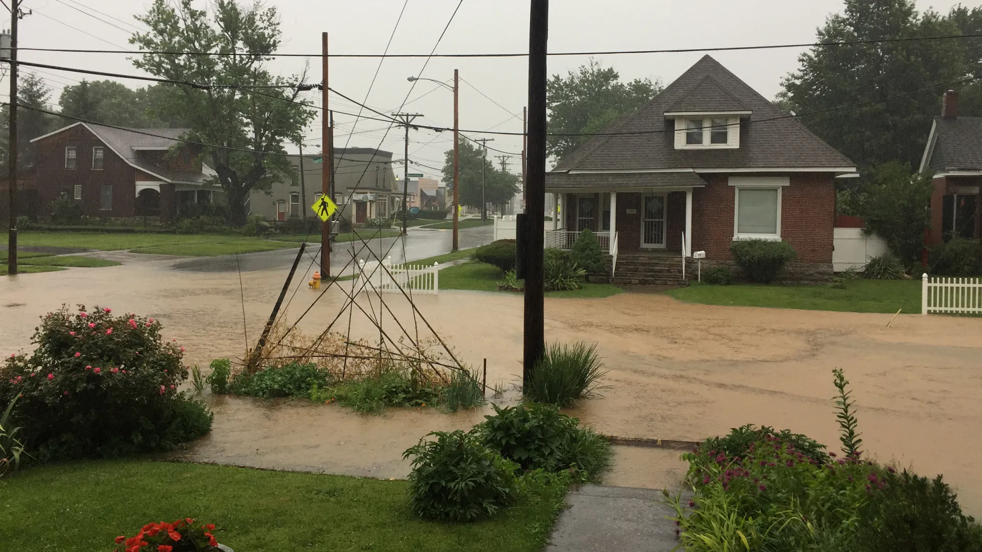 Flooding covers a neighborhood street in Kentucky